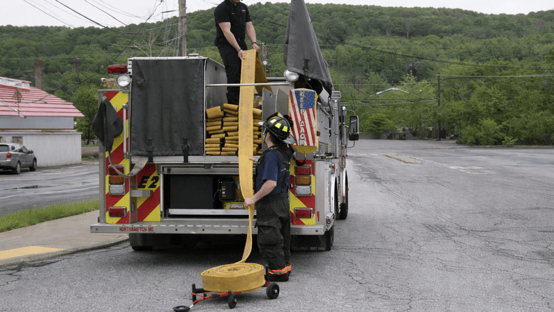 Hoze Dolly reducing the amount of firefighters needed. 